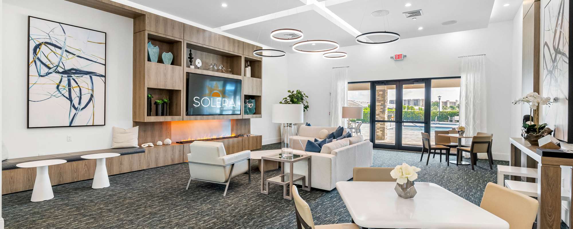 Bright seating area with modern decor at Solera at Avalon Trails in Delray Beach, Florida