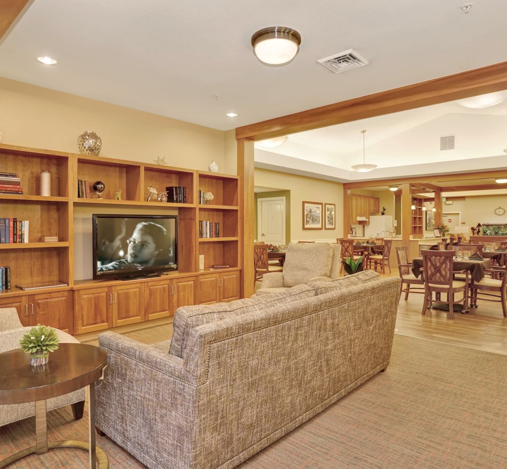 Common area with TV at Seven Lakes Memory Care in Loveland, Colorado