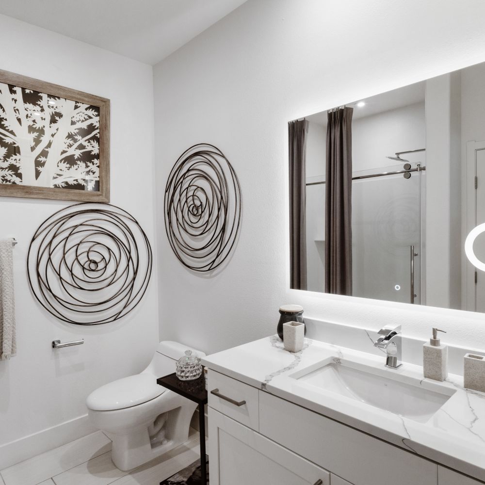 Bright, modern bathroom with elegant fixtures at Revolution in Henderson, Nevada