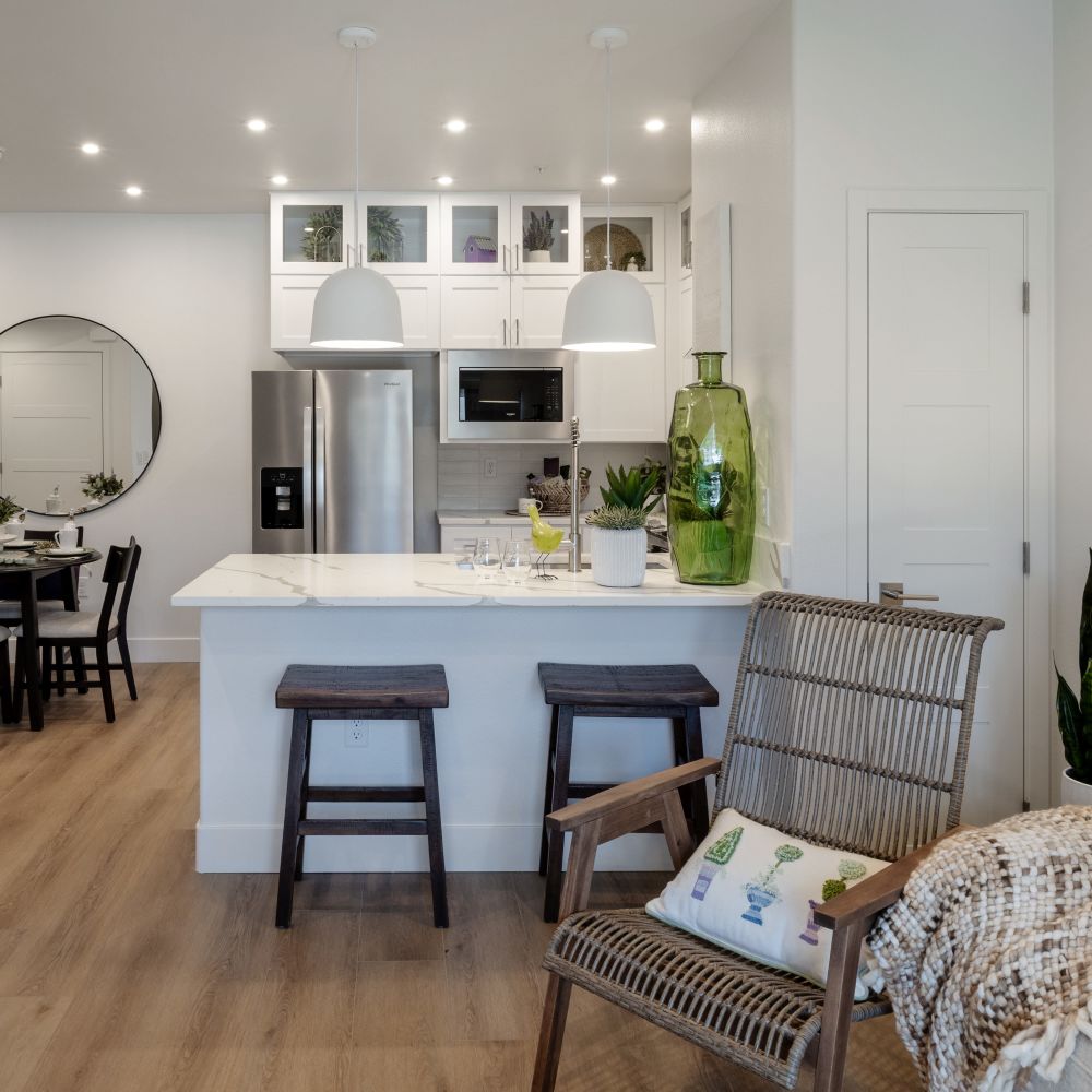 Kitchen island with bar stools and decor at Continuum Apartments in Las Vegas, Nevada