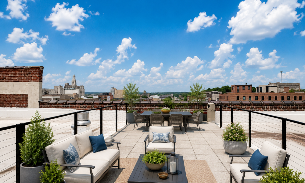 Rooftop patio with seating and city skyline views at Crescent Lofts in Davenport, Iowa