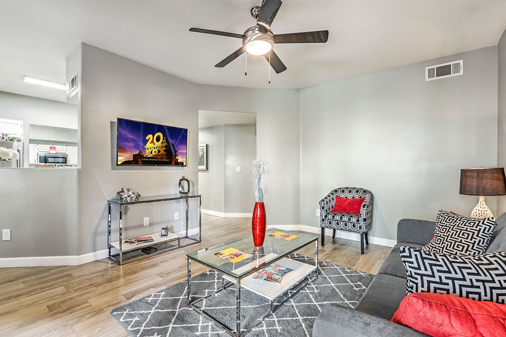 Living space with a ceiling fan at Calypso Apartments in Las Vegas, Nevada