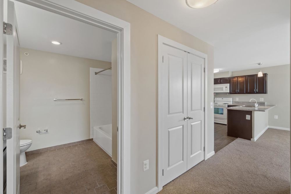 Bathroom with tub and kitchen area at Penn Square II in Baltimore, Maryland