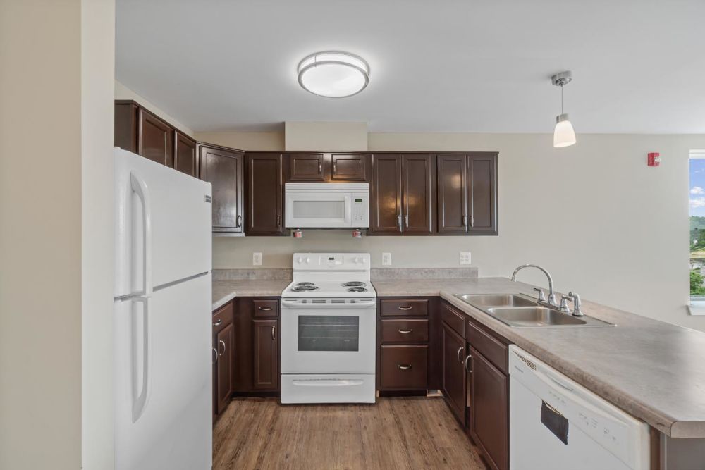 Granite countertops with stainless steel appliances at Penn Square II in Baltimore, Maryland