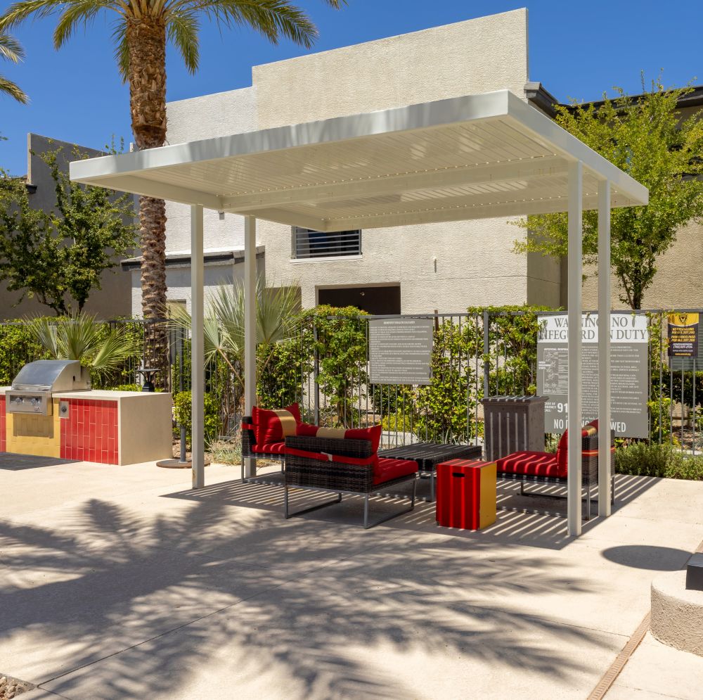 Shaded seating area with modern furniture at Revolution in Henderson, Nevada