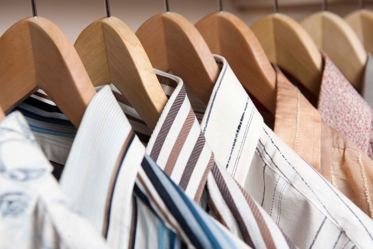 Closet self with clothes at New Market North Apartments in New Market, Virginia