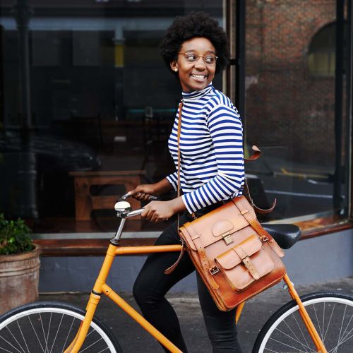 Woman biking to work near Crystal Commons Townhomes in Gates, New York