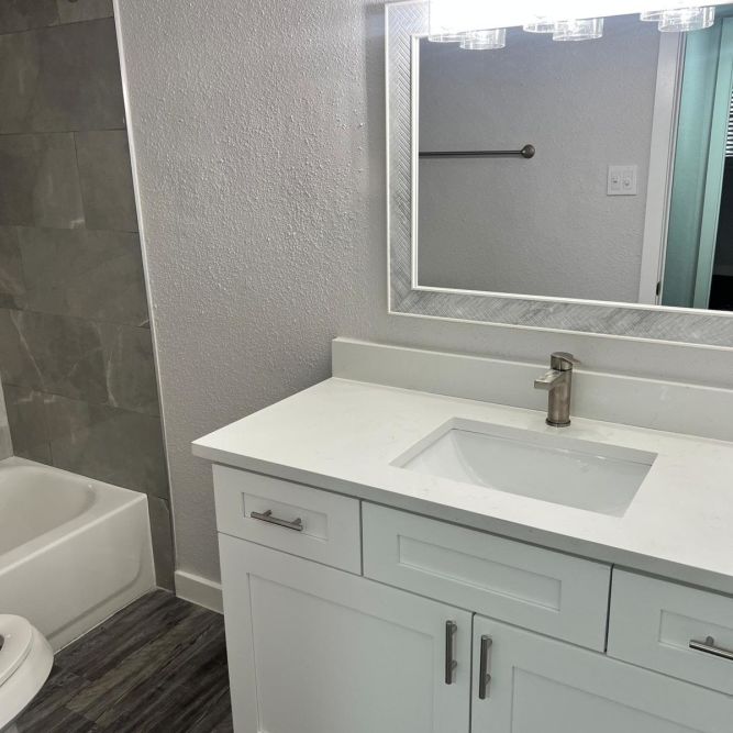 Modern bathroom with sleek vanity at Serenity at Cityside in Houston, Texas
