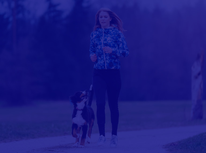 Resident running with her dog at Japanese Gulch Trail near Carvel Harbour Pointe in Mukilteo, Washington