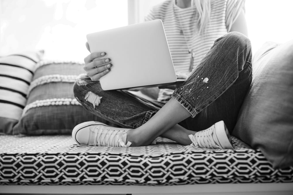 Resident working on a laptop at IDENTITY Boise in Boise, Idaho