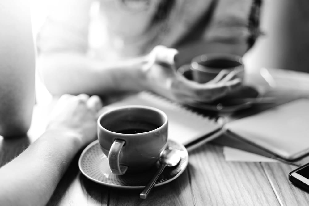 Friends enjoying a cup of coffee in Reno, Nevada near IDENTITY Reno