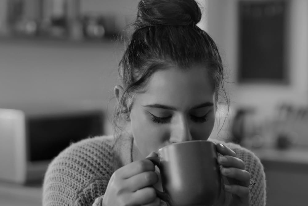 Resident sipping on some tea at IDENTITY Moscow in Moscow, Idaho