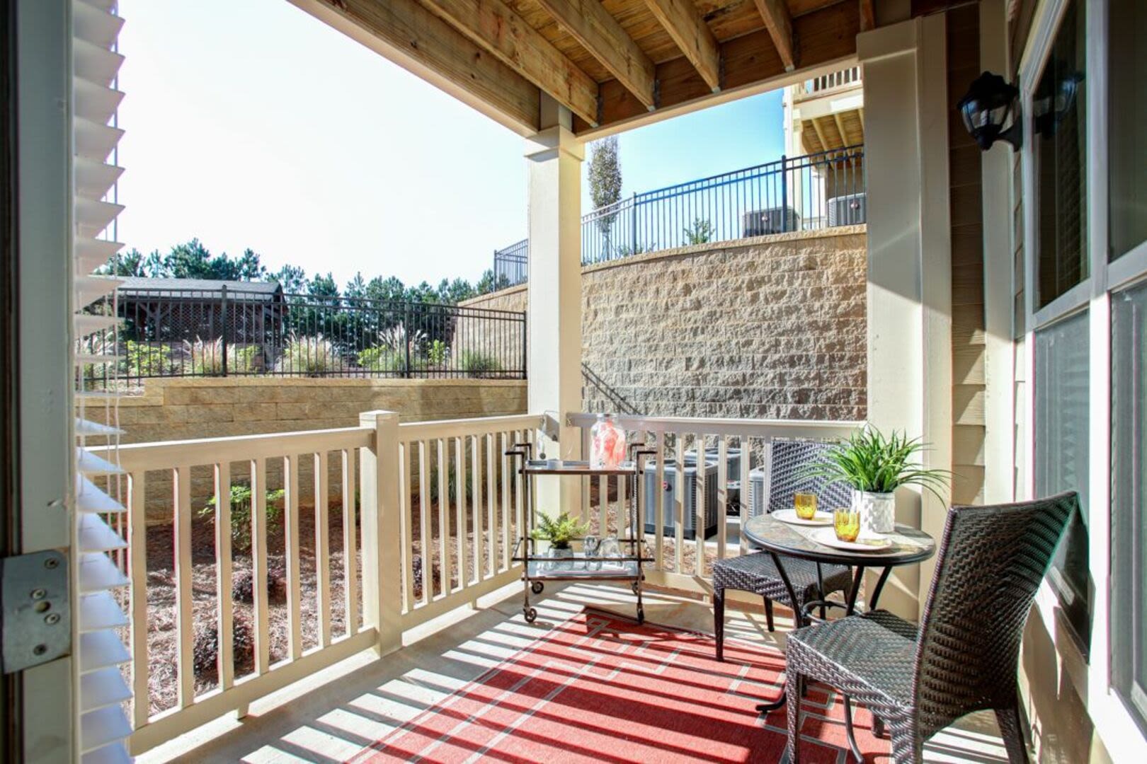 Balcony with red rug at Avonlea Creekside in Marietta, Georgia