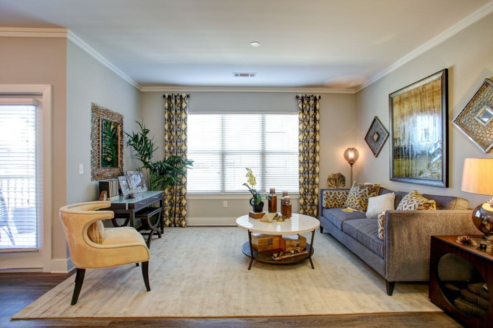 Model living space with large rug Avonlea Creekside in Marietta, Georgia