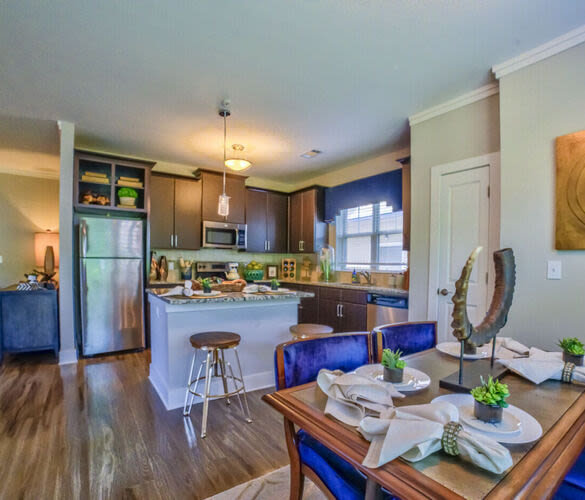 Model dining area with blue accents Avonlea Creekside in Marietta, Georgia