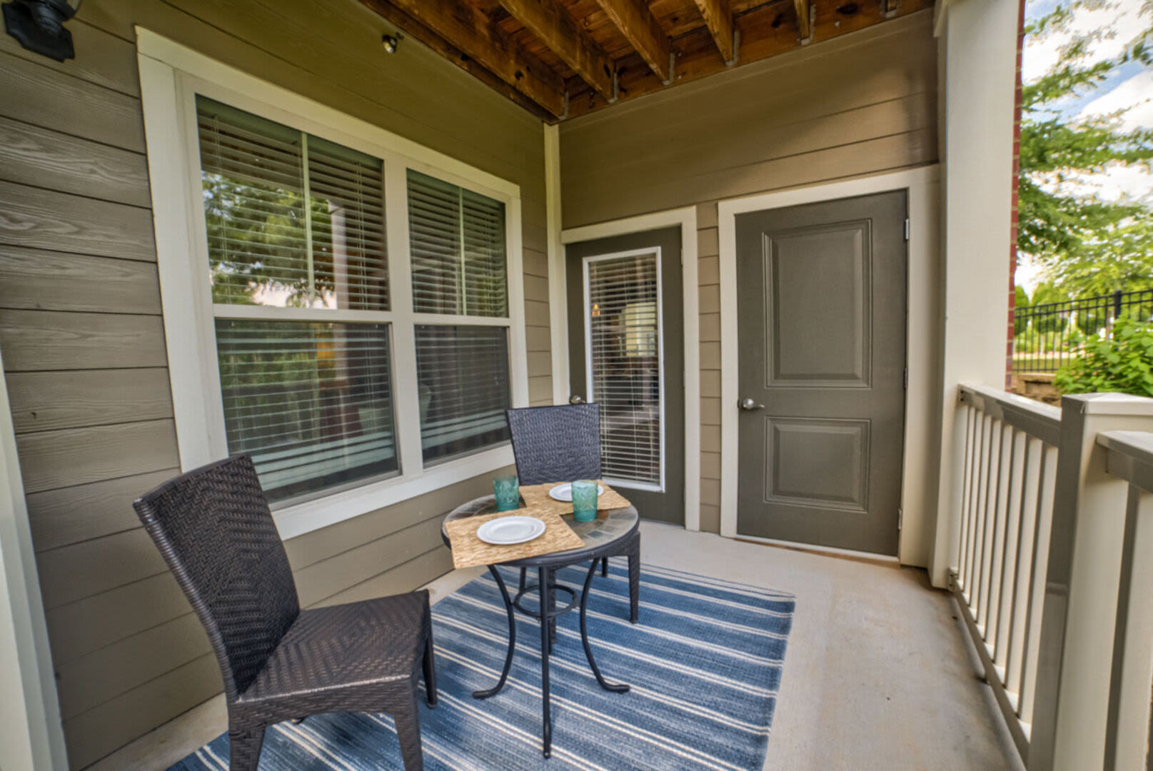 Balcony area with blue rug Avonlea Creekside in Marietta, Georgia