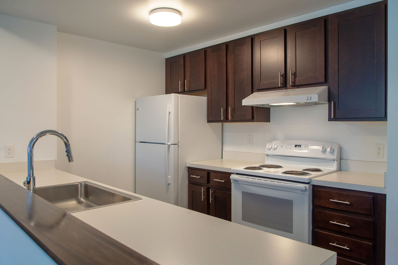 Kitchen with white color appliance at 61 Heath in Jamaica Plain, Massachusetts