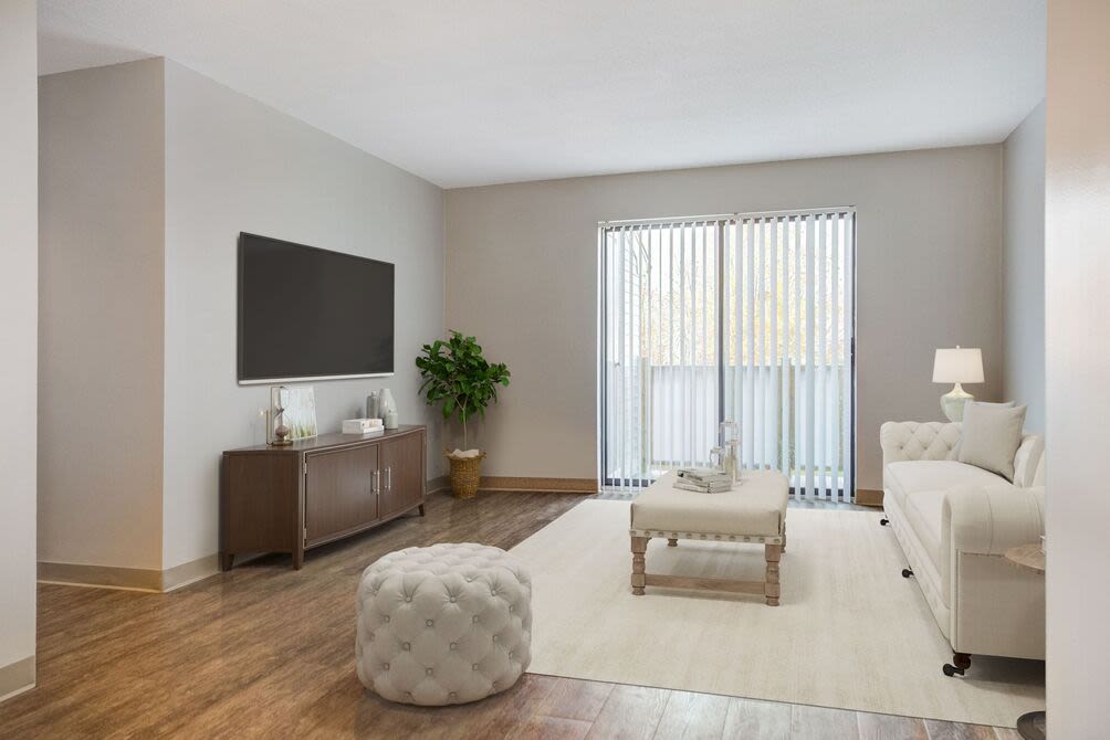 Spacious living room with couch and coffee table at 840 County in Taunton, Massachusetts