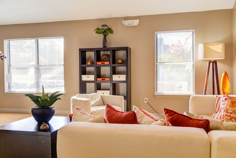 Bright living room with couch, chairs and window at 840 County in Taunton, Massachusetts