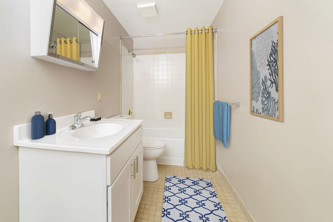Bathroom with a toilet, shower and a bathtub at Anchors Weigh in Chelsea, Massachusetts