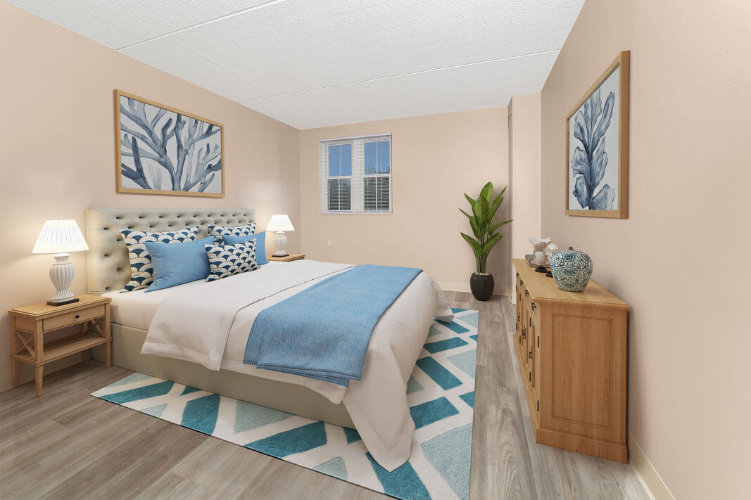 Bedroom with a bed and side lamps at Anchors Weigh in Chelsea, Massachusetts