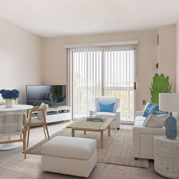 Living room with a comfortable couch, large window and a TV at Anchors Weigh in Chelsea, Massachusetts