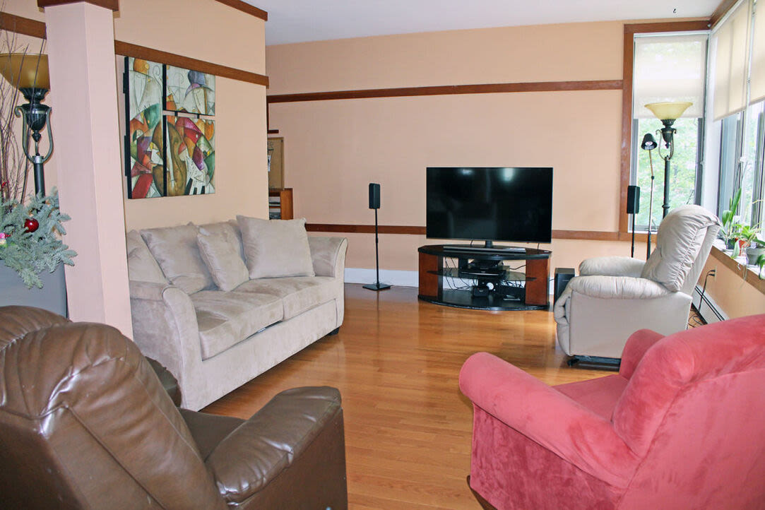 Apartment living room with television at Angela Westover House in Jamaica Plain, Massachusetts