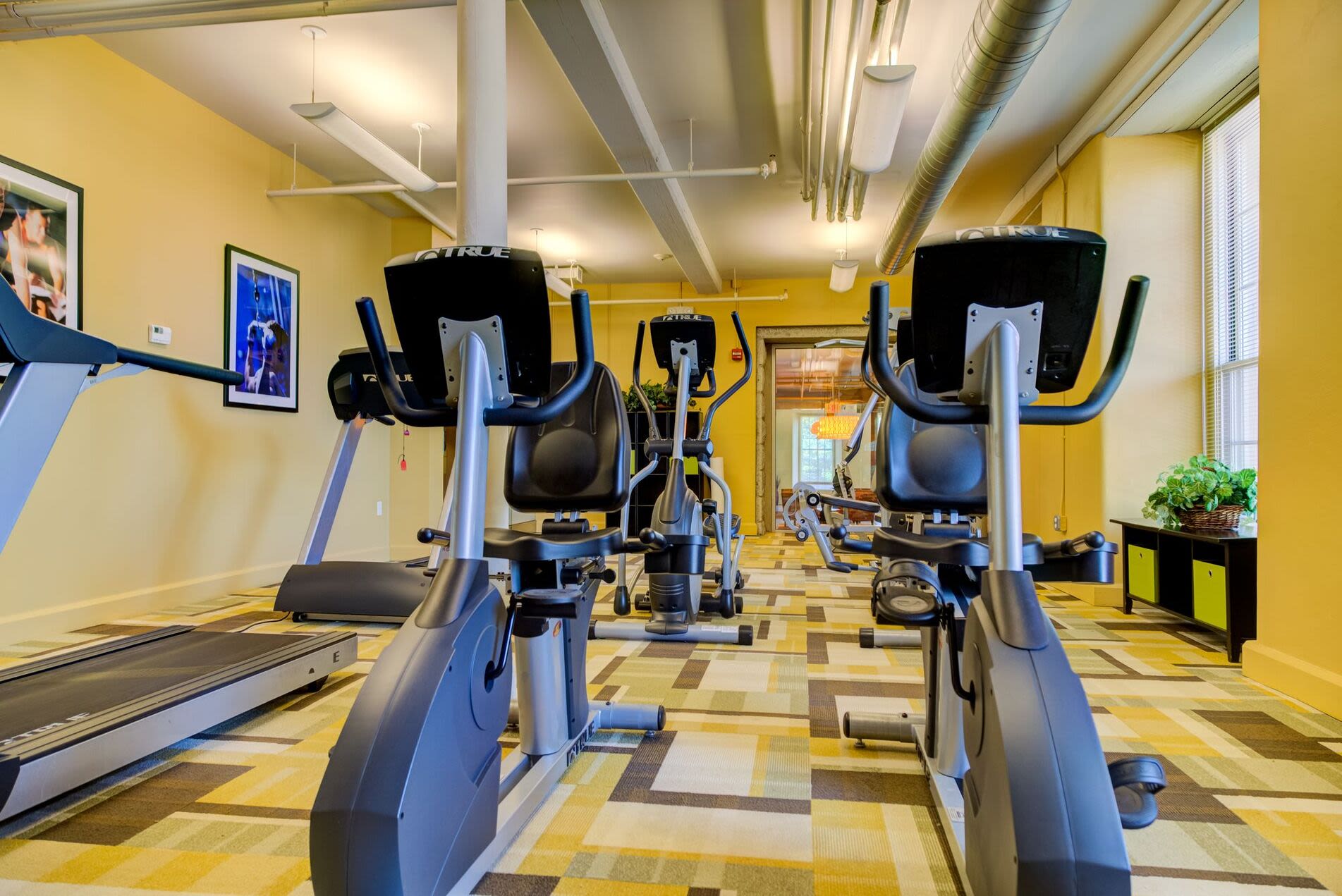 Fitness center with treadmill at Bourne Mill in Tiverton, Rhode Island