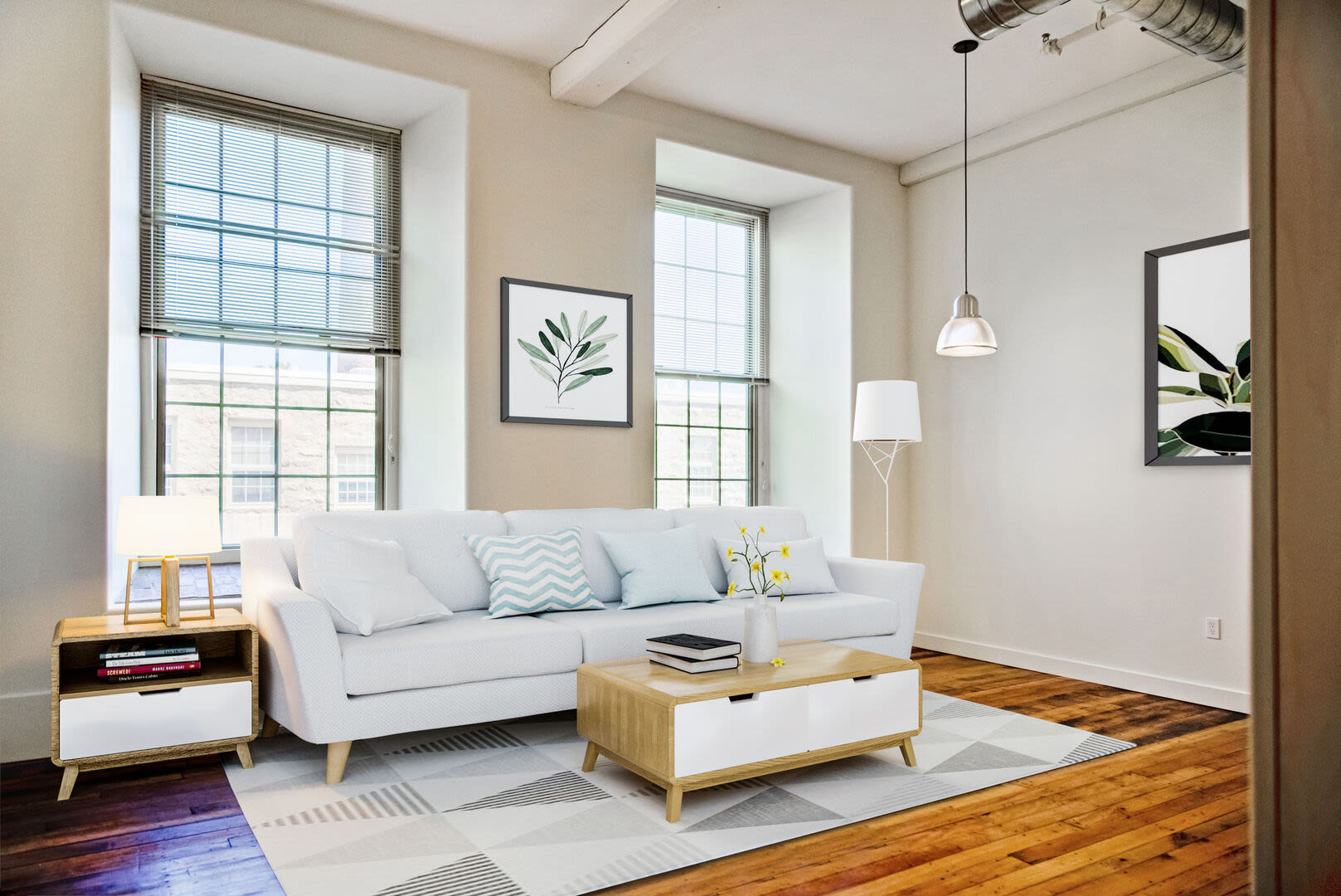 Living room with two large window at Bourne Mill in Tiverton, Rhode Island