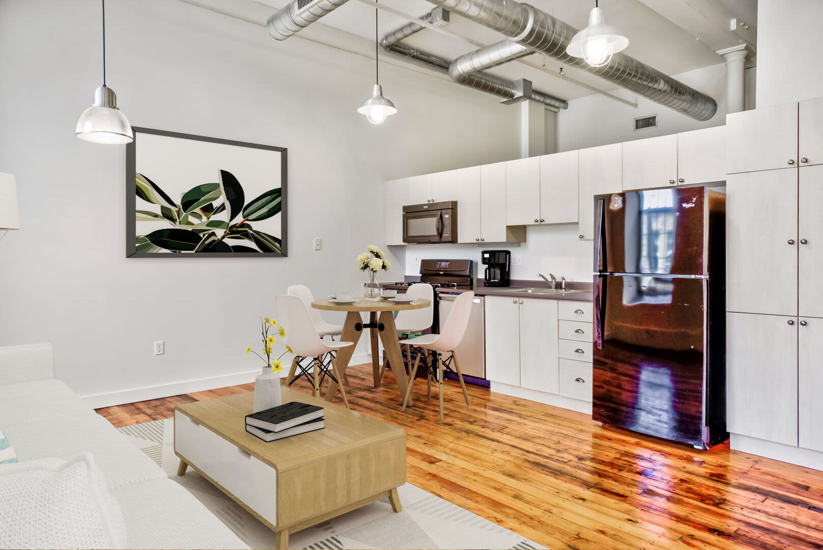 Kitchen with white color cabinets at Bourne Mill in Tiverton, Rhode Island