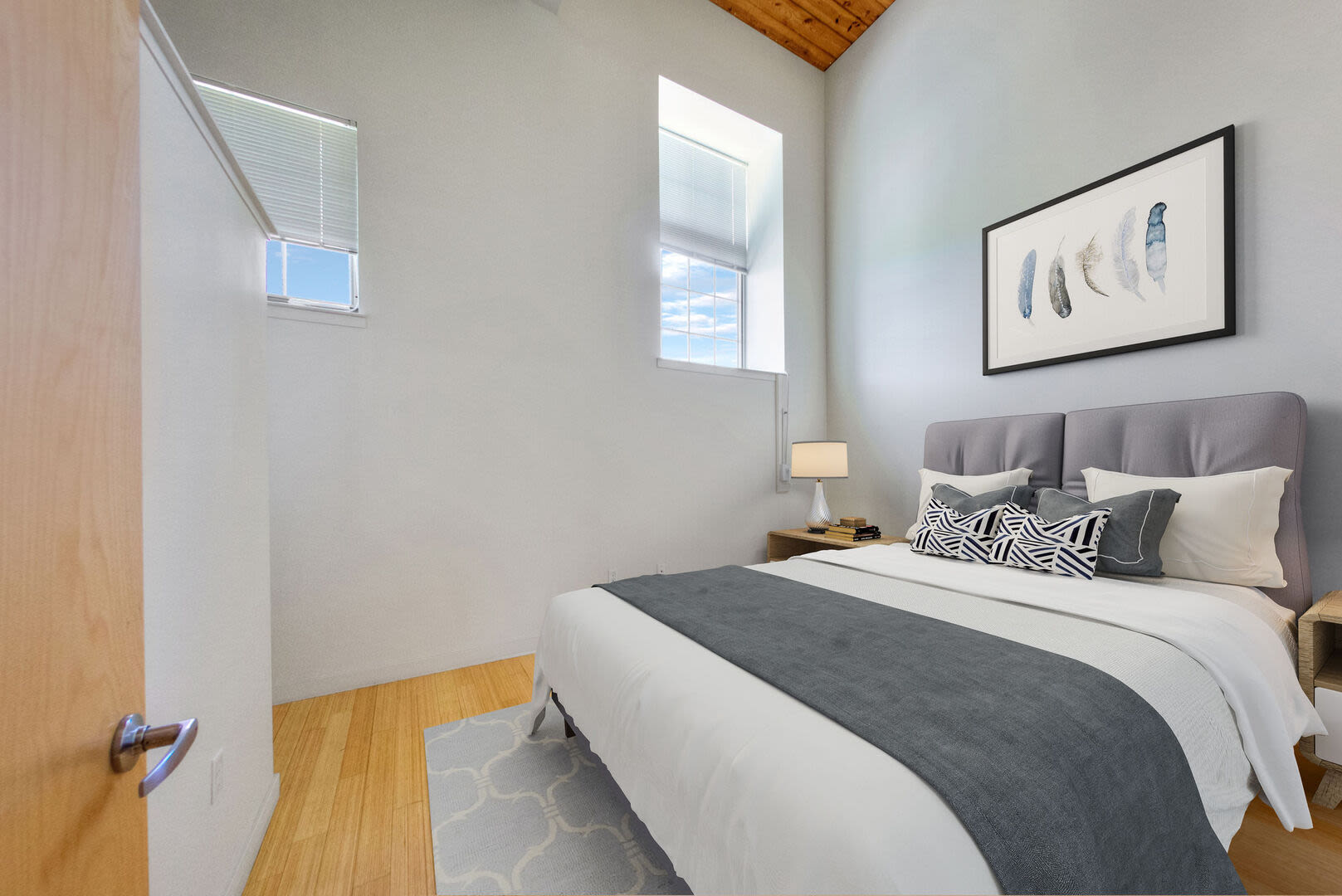 Bedroom with nice wall art at Bourne Mill in Tiverton, Rhode Island