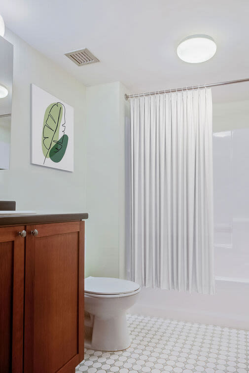 Bathroom with bath tub at Bourne Mill in Tiverton, Rhode Island