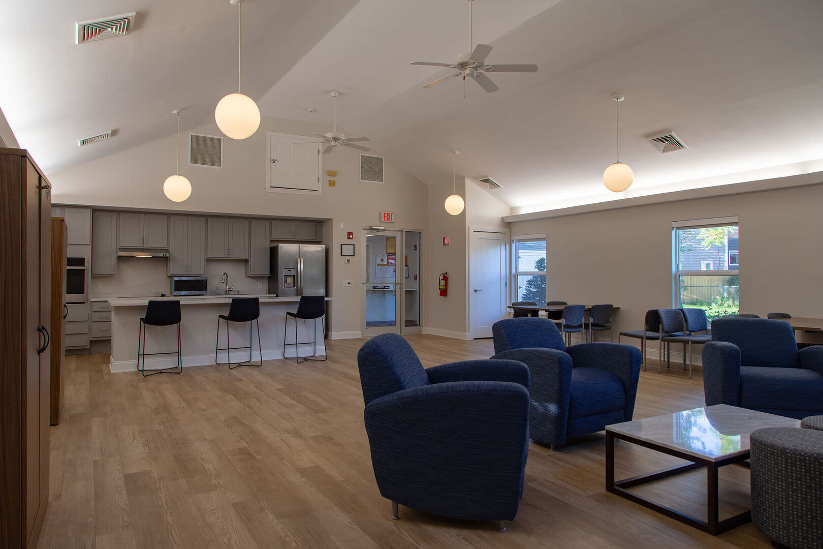 Spacious living room with easy access to kitchen at Brook Avenue Apartments in Roxbury, Massachusetts