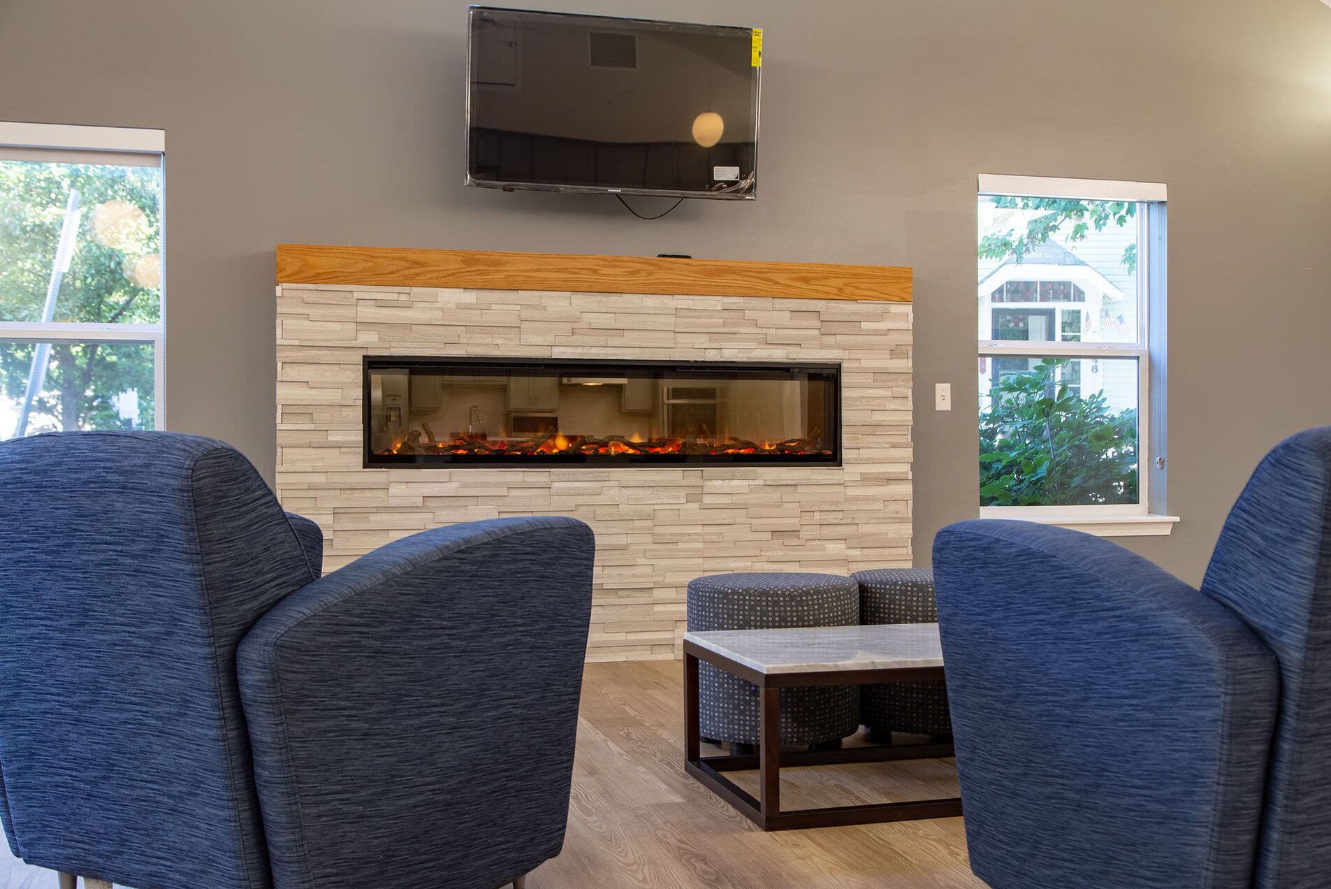 Living room with couch, coffee table and fire place at Brook Avenue Apartments in Roxbury, Massachusetts