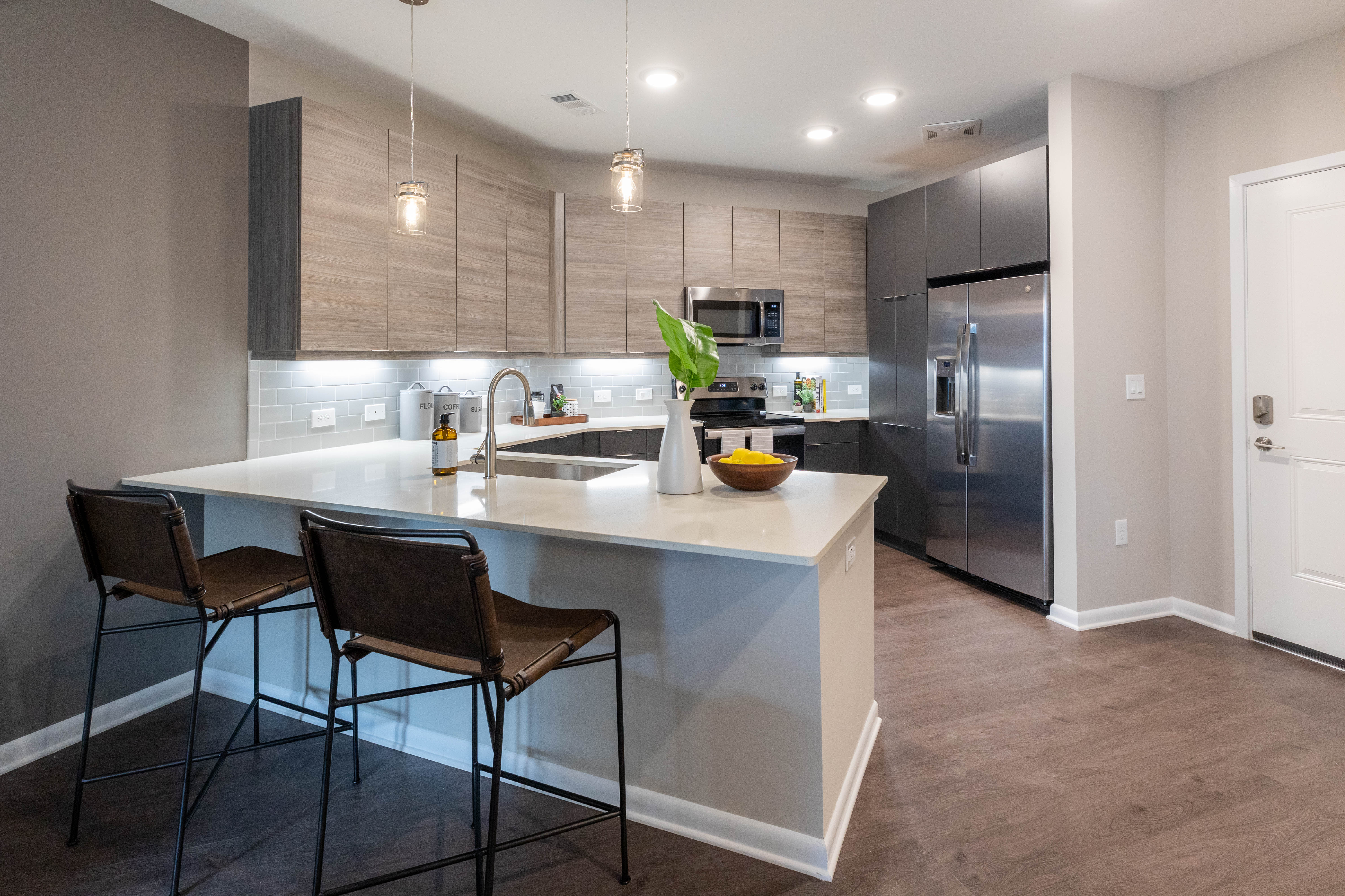 Model kitchen with wood flooring The Jade at Avondale in Decatur, Georgia