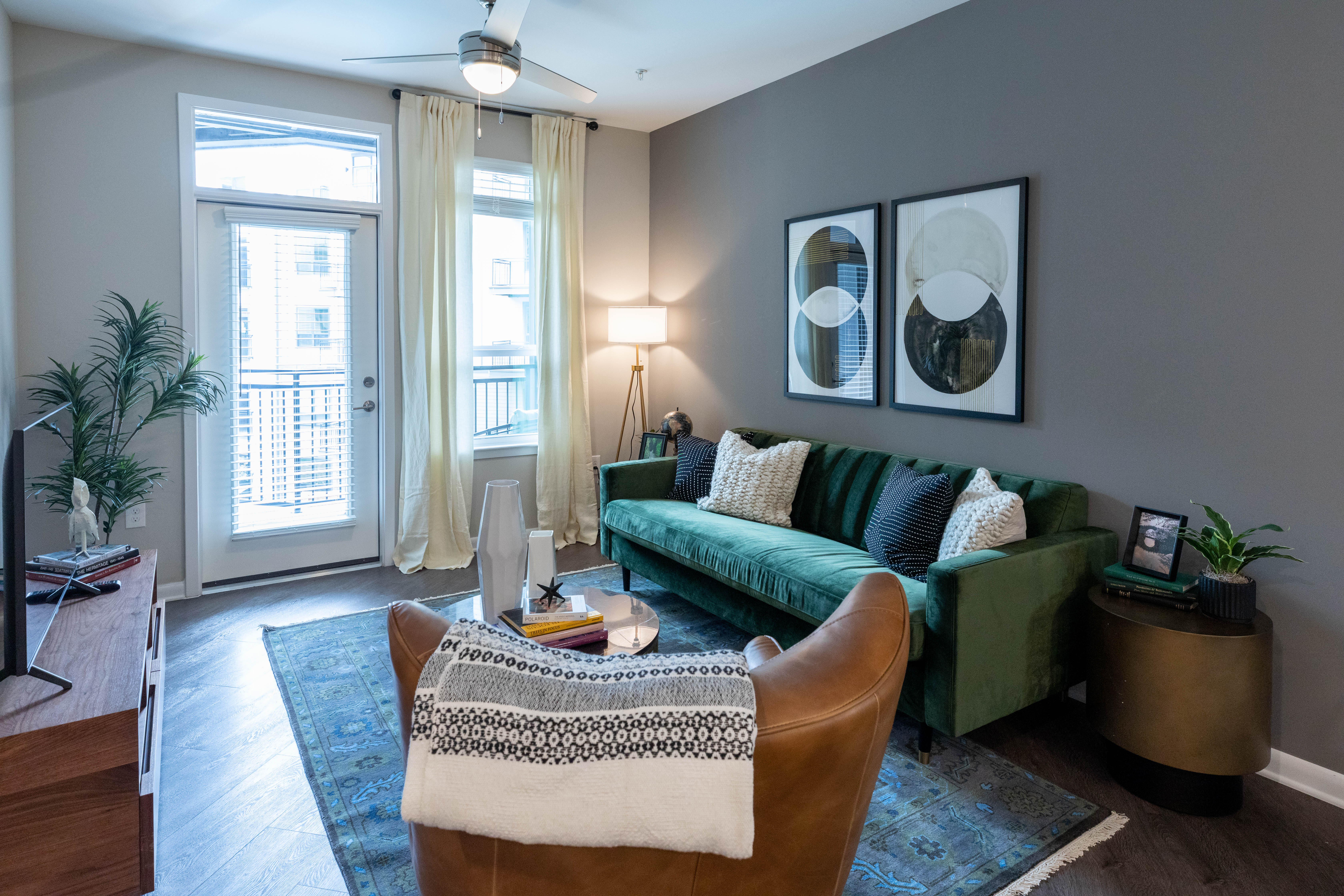 Model living space with wall art The Jade at Avondale in Decatur, Georgia