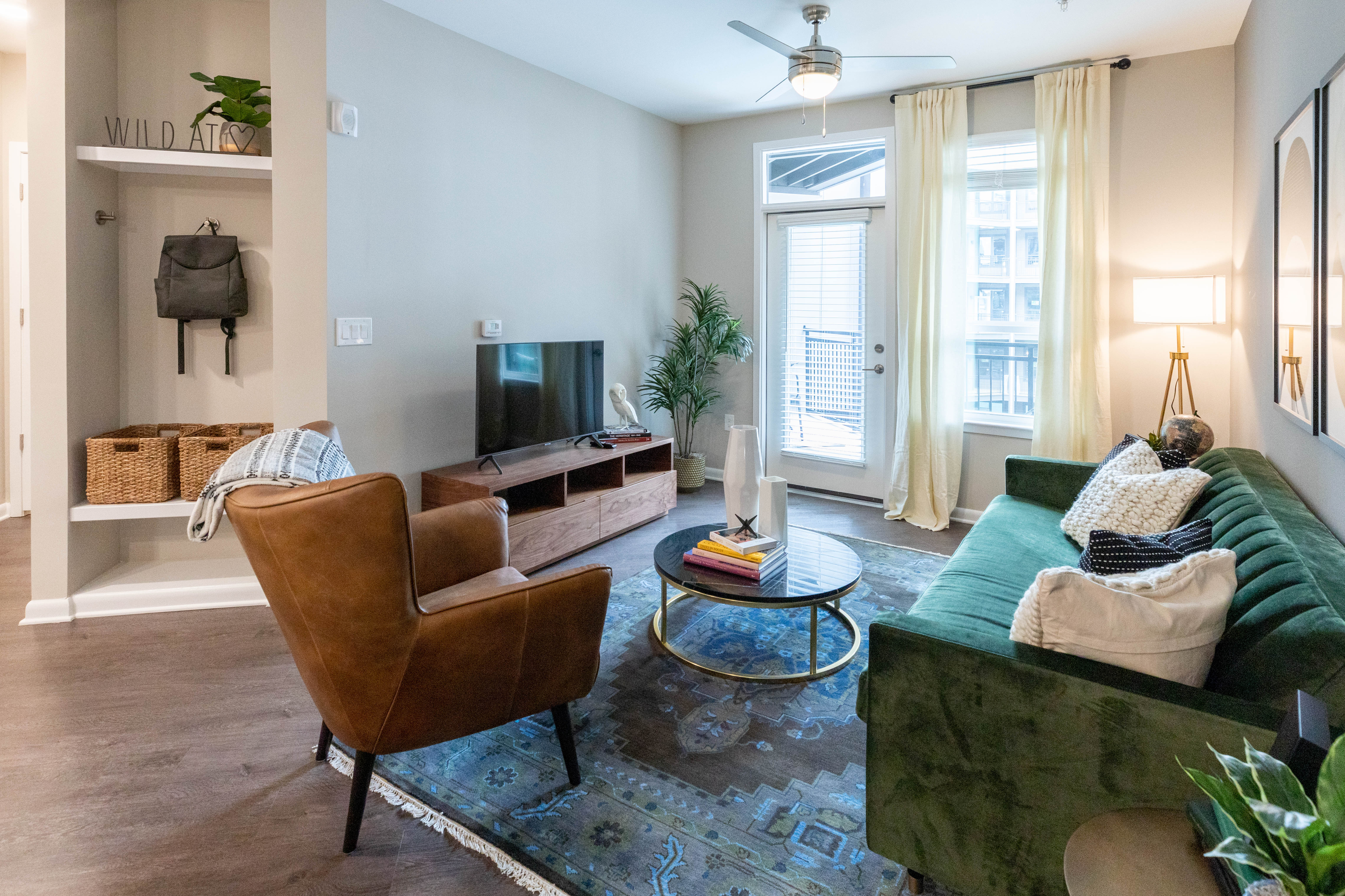 Model living space with ceiling fan The Jade at Avondale in Decatur, Georgia