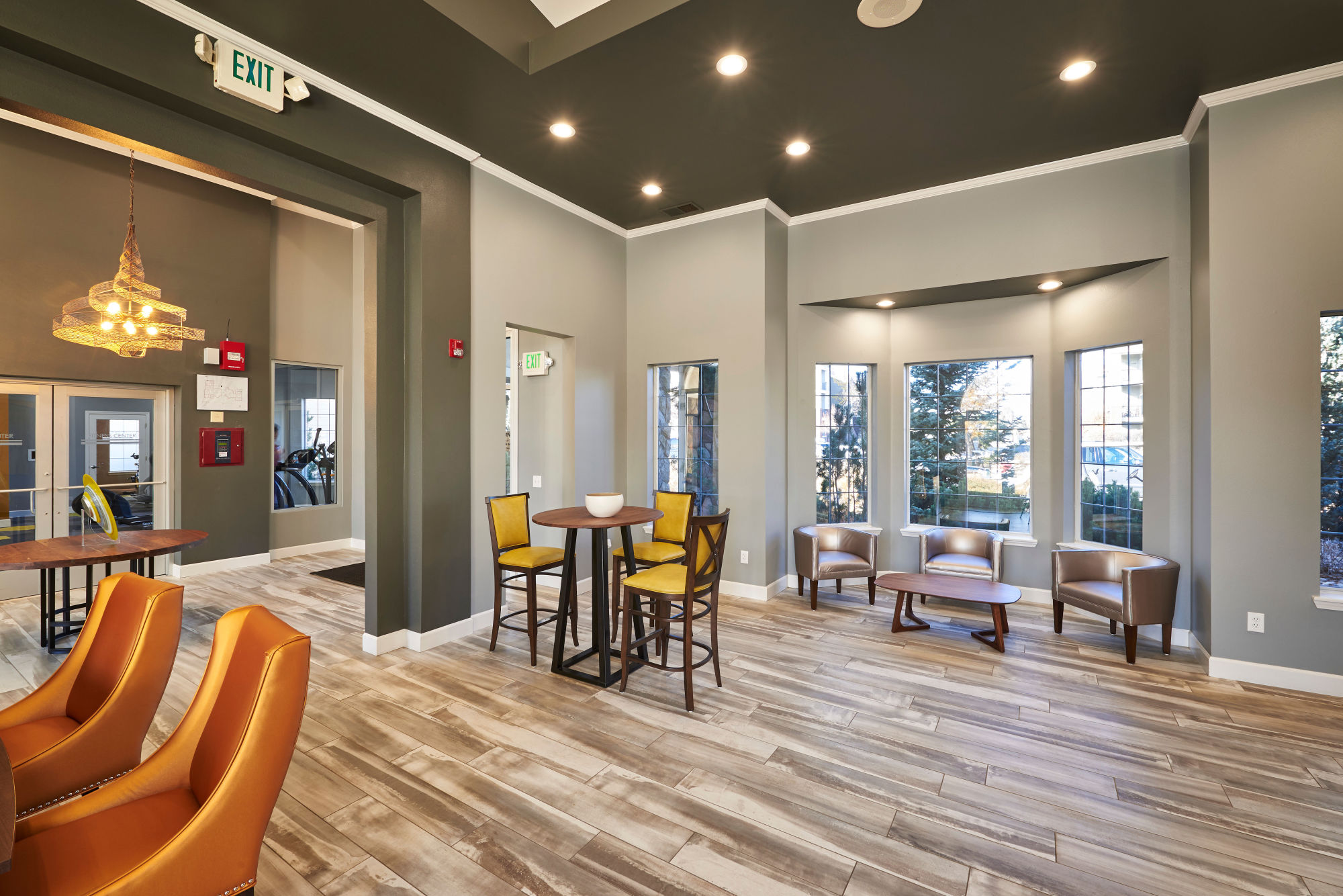 Resident lounge with a fireplace at Legend Oaks Apartments in Aurora, Colorado