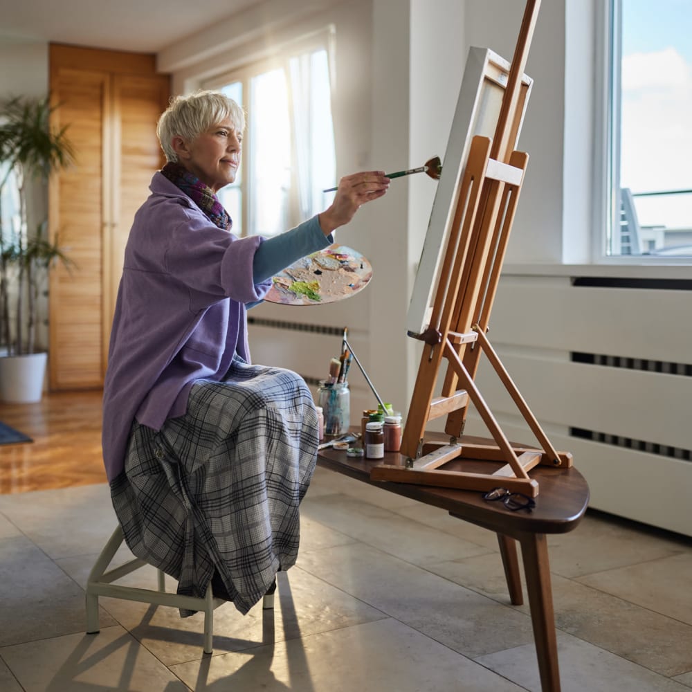 Resident painting at Regency Care Center at Monroe in Monroe, Washington