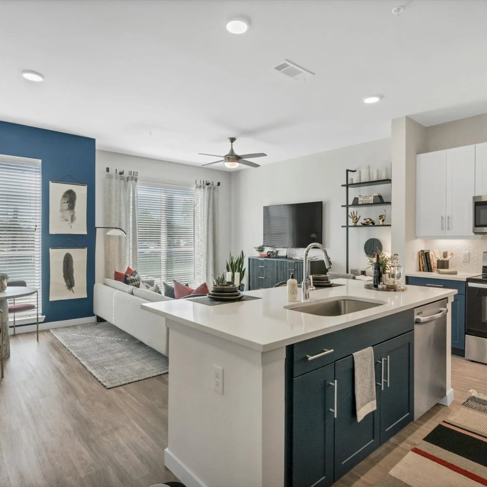 Apartment kitchen with an island at Ross + Peak in Dallas, Texas