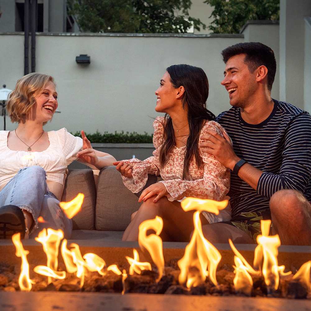 Residents by the firepit outside at 1801L Apartments in Sacramento, California