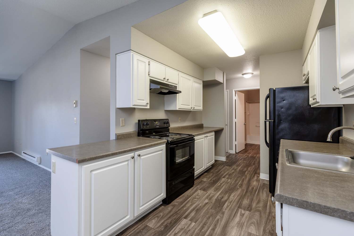 Kitchen with black appliances at Arnada Pointe in Vancouver, Washington