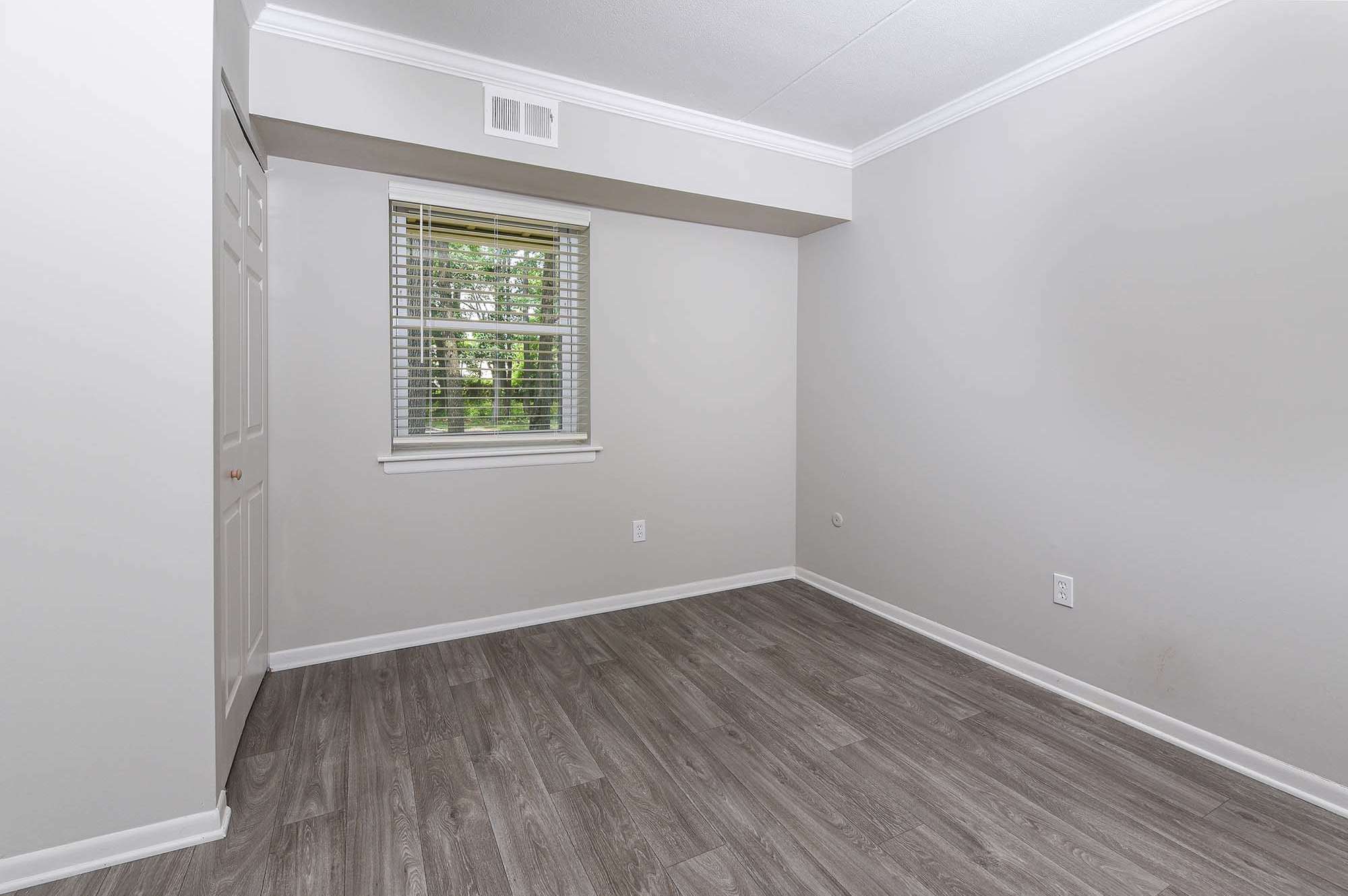 Unfurnished room with hardwood-style flooring at The Nolan in Morrisville, Pennsylvania