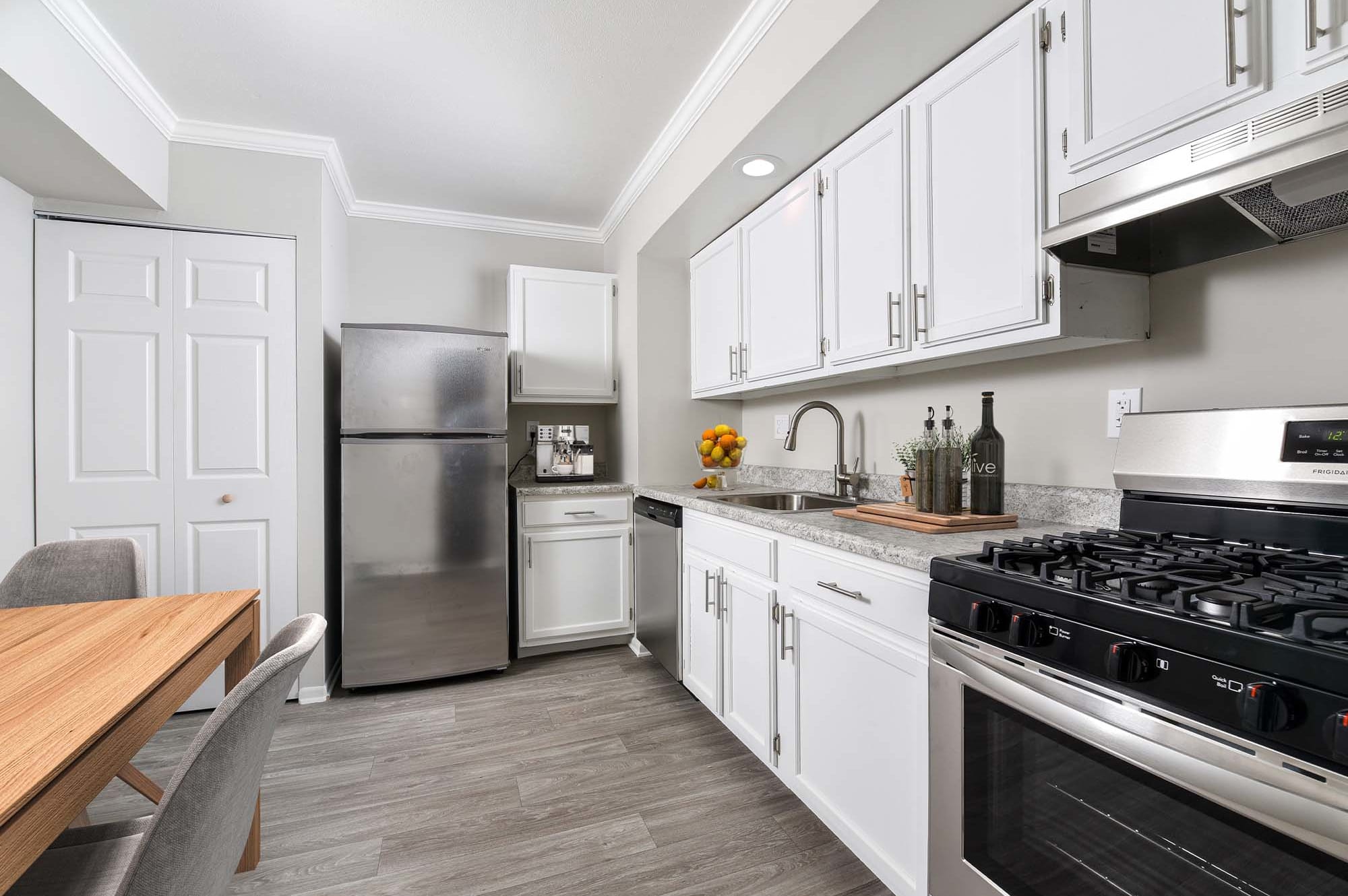 Model kitchen with white cabinets at The Nolan in Morrisville, Pennsylvania