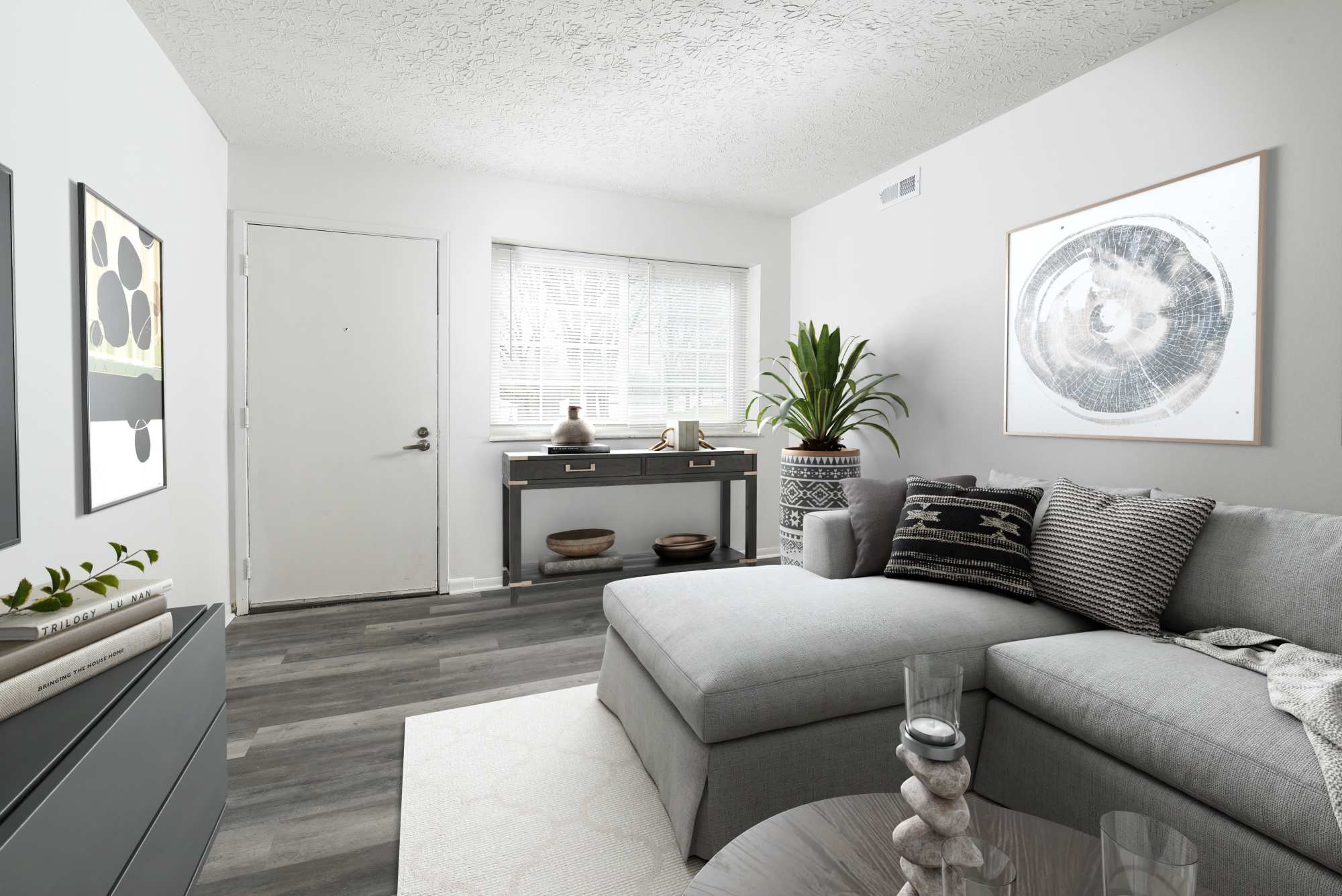 East living room with hardwood like vinyl flooring at Pointe at Northern Woods in Columbus, Ohio