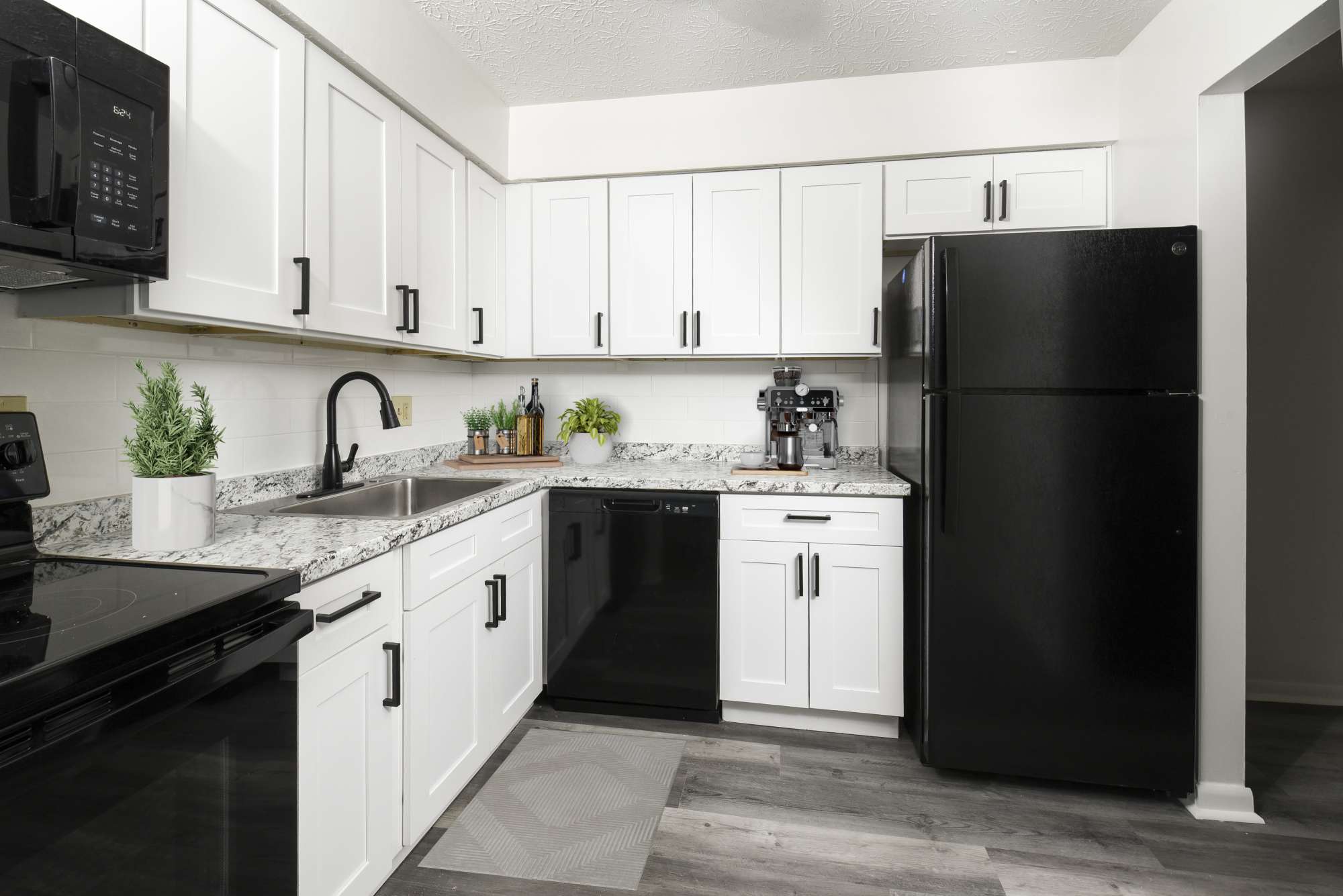 East kitchen with white cabinets at Pointe at Northern Woods in Columbus, Ohio
