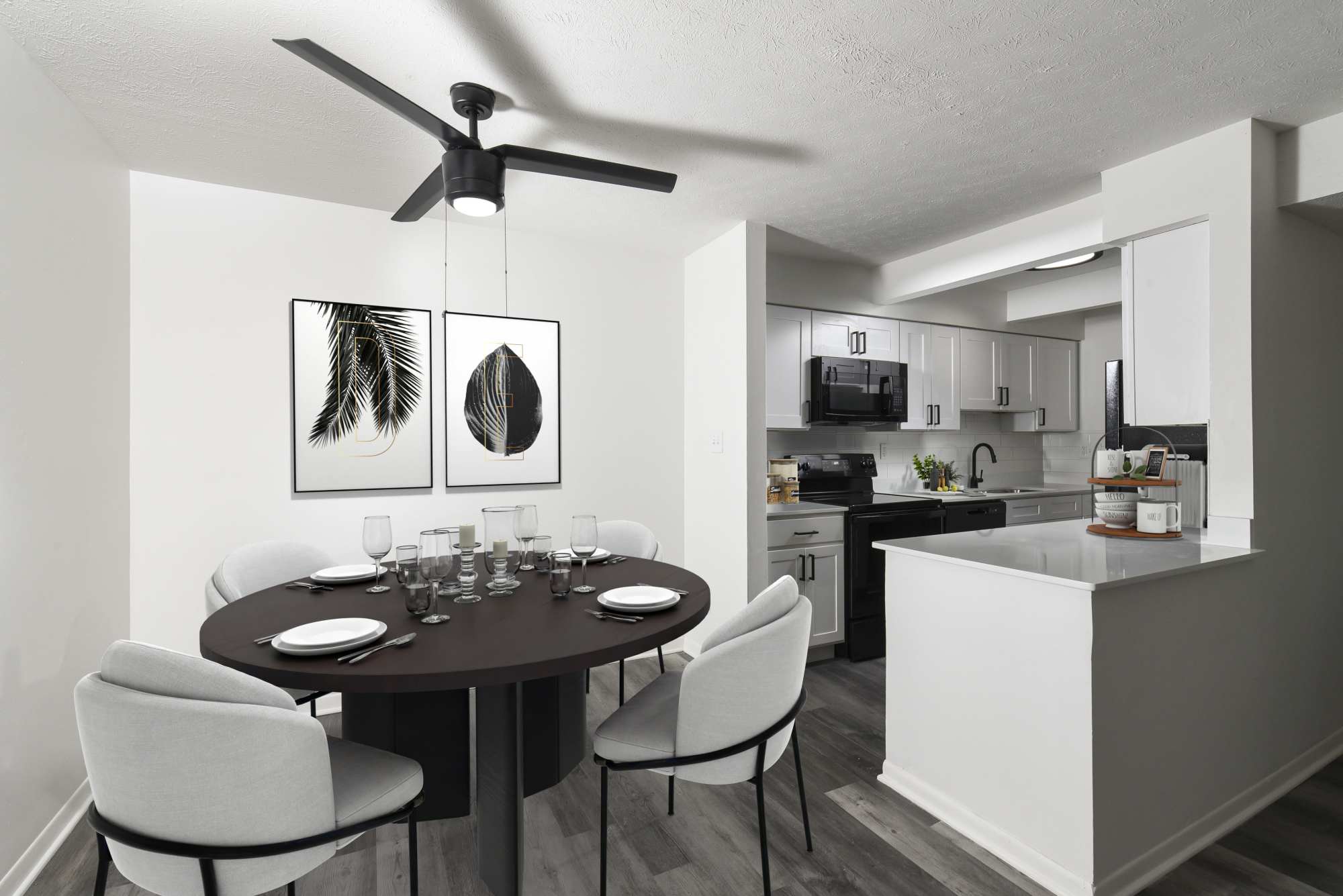 West dining area with ceiling fan at Pointe at Northern Woods in Columbus, Ohio