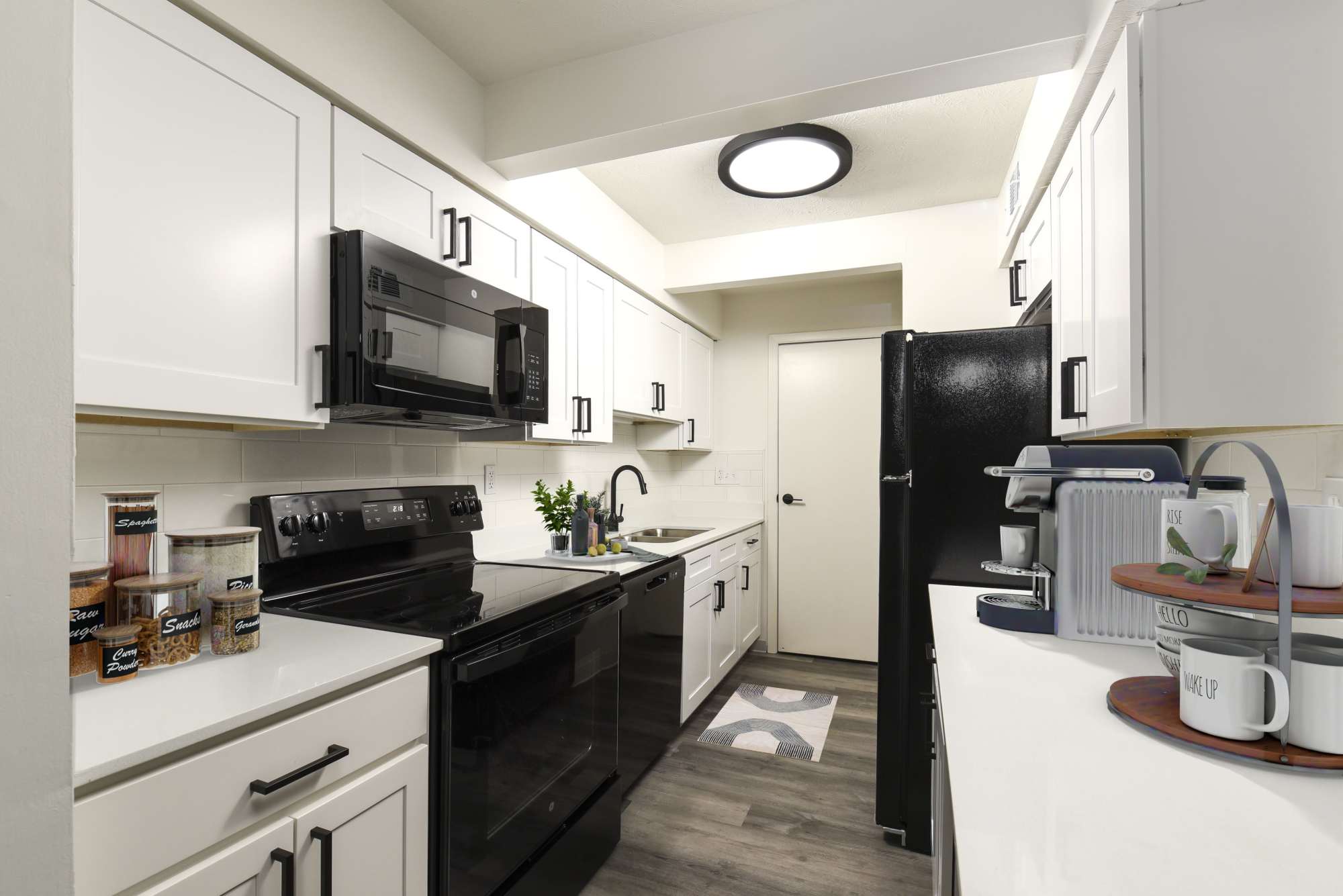 West kitchen with white-tile backsplash at Pointe at Northern Woods in Columbus, Ohio