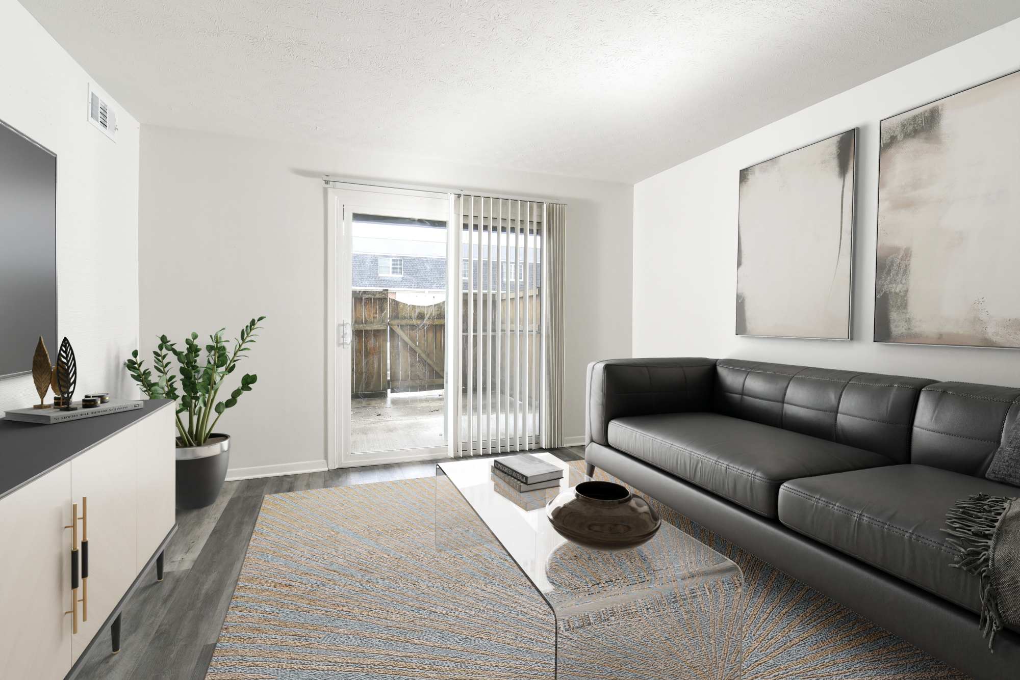 West living room with hardwood-like vinyl flooring at Pointe at Northern Woods in Columbus, Ohio