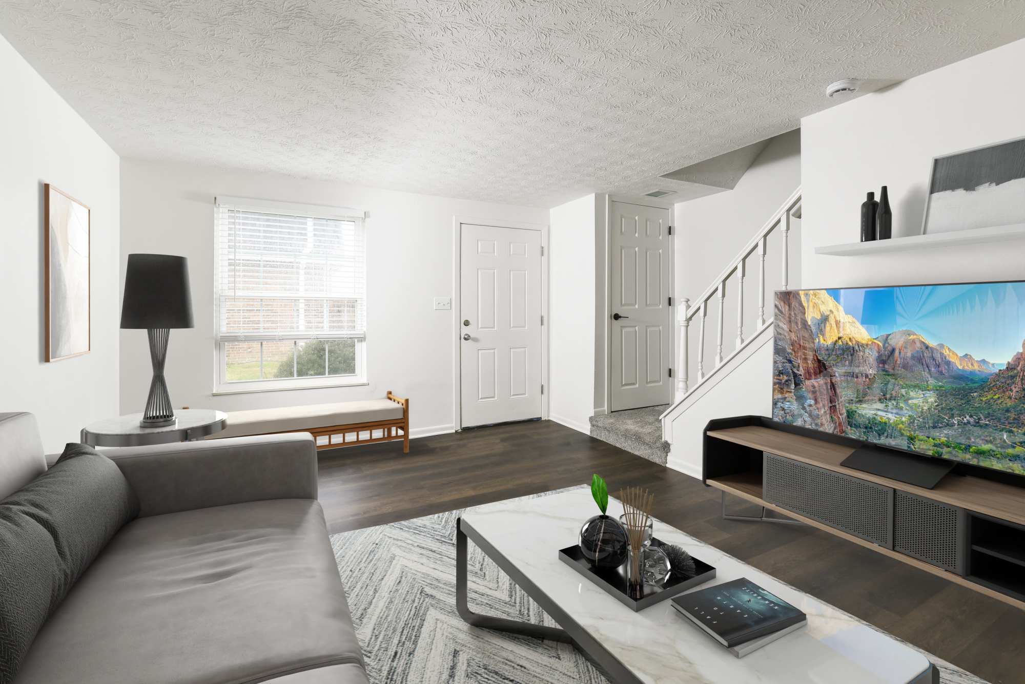 West living room with TV at Pointe at Northern Woods in Columbus, Ohio